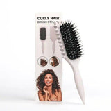 Brosse définissante pour cheveux bouclés